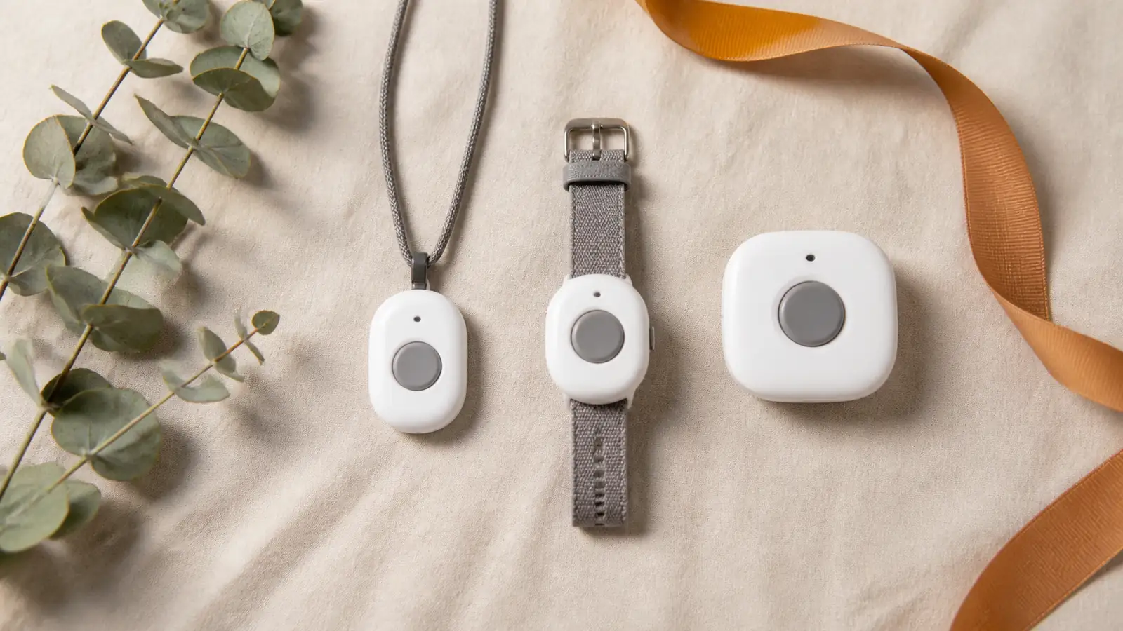 Pendant, watch, and wall-button medical alert devices arranged for comparison